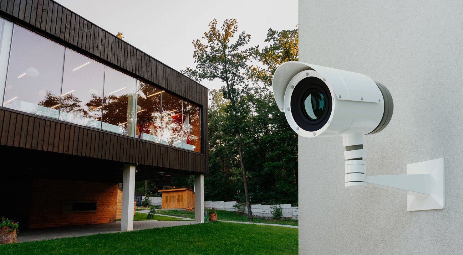 Exterior surveillance camera protecting a modern residence